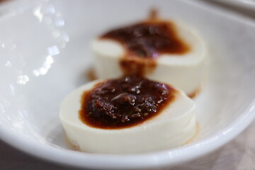 Classic Korean tofu with soy sauce and chilli on plain white dish