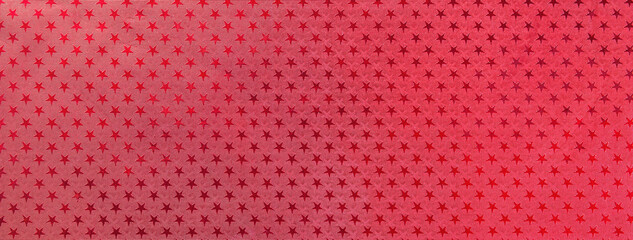 Dark red christmas background from metal foil paper with a pattern of sparkling stars, macro. Wine backdrop.