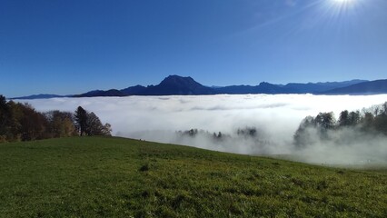 sunny alpine panorama over fog - mount Traunstein