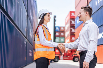 Obraz premium Caucasian businesswoman and businessman worker work in container port.