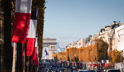 Traffic on Champs Elysee boulevard from Paris, France, with view to Arch of Triumph. Landmarks of...