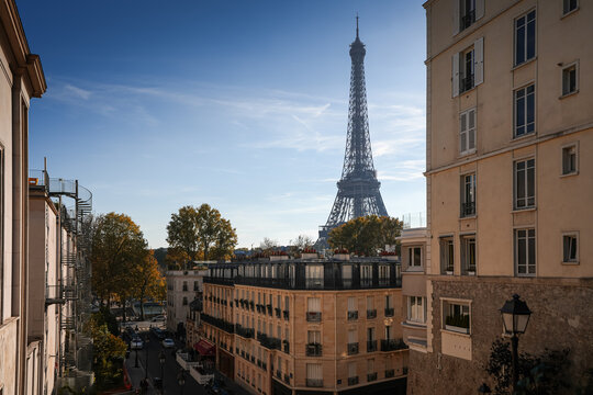 Autumn in Paris. Photo with the silhouette of Eiffel Tower during a sunny day with blue sky. Travel to France.