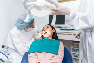 Orthodontist doctor examine tooth to woman patient at dental clinic