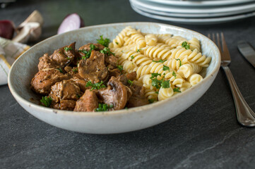 Chicken ragout with mushrooms  and fusilli noodles