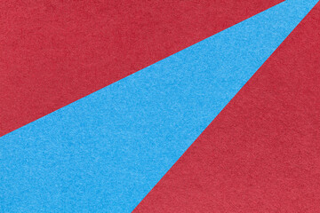 Texture of old craft red and blue color paper background, macro. Structure of vintage abstract ruby cardboard
