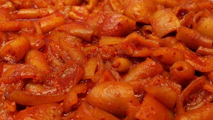 Tteokbokki or spicy rice cakes - South Korean food in chilli tomato sauce