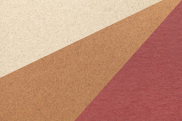 Fototapeta premium Texture of old craft beige, brown and maroon color paper background, macro. Structure of vintage abstract cardboard