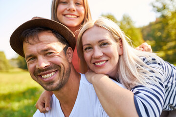 Happy parents and daughter on a trip