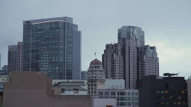 A short clip of random building in San Francisco City. You can see the American Flag in the distance. 