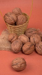 Closeup photo of a walnut seed in wooden bowl. Food that is good for brain and lower risk of heart disease.