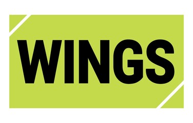 WINGS text written on green-black stamp sign.