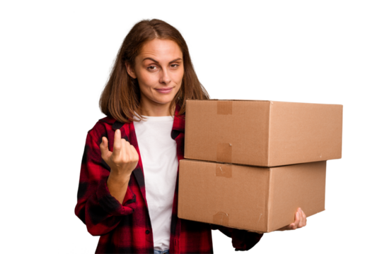 Young caucasian woman moving while picking up a box full of things isolated pointing with finger at you as if inviting come closer.