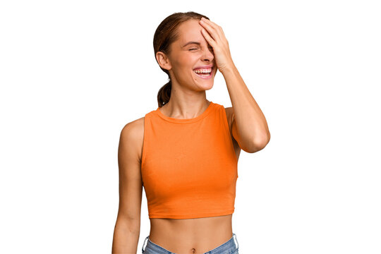 Young caucasian woman isolated laughing happy, carefree, natural emotion.