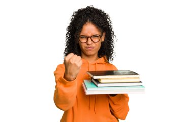 Young student woman holding a pile of books isolated showing fist to camera, aggressive facial expression.