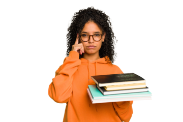 Young student woman holding a pile of books isolated pointing temple with finger, thinking, focused on a task.
