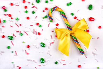 Christmas background of colorful candies, lollipop cane on a white background, close-up