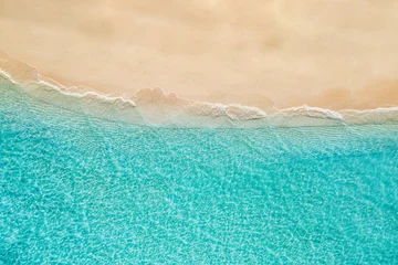 Türaufkleber Summer seascape beautiful waves, blue sea water in sunny day. Top view from drone. Sea aerial view, amazing tropical nature background. Beautiful bright sea waves splashing and beach sand sunset light © icemanphotos