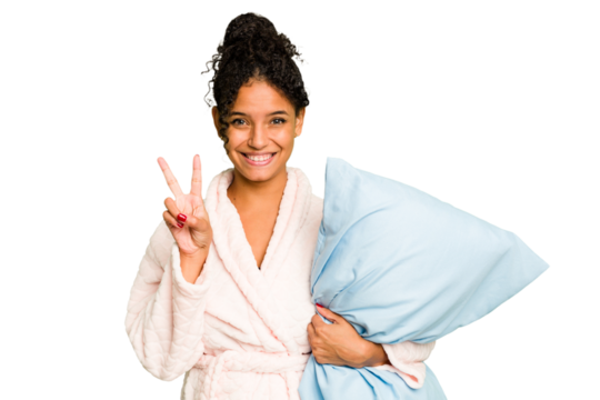 Young brazilian woman wearing a pajama holding a pillow isolated showing number two with fingers.