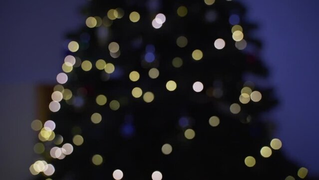 Fairy light on a Christmas tree festive blurred bokeh abstract background 