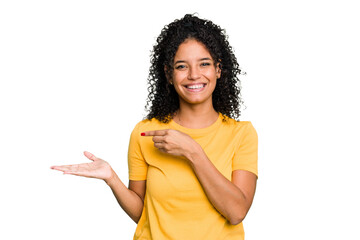 Young cute brazilian woman isolated excited holding a copy space on palm.