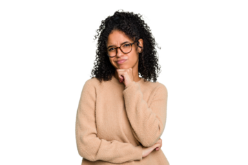 Young cute brazilian woman isolated thinking and looking up, being reflective, contemplating, having a fantasy.