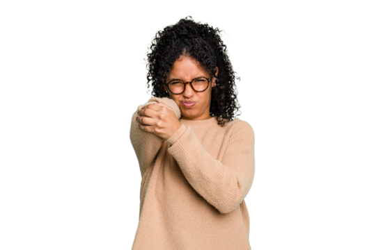 Young cute brazilian woman isolated having a neck pain due to stress, massaging and touching it with hand.