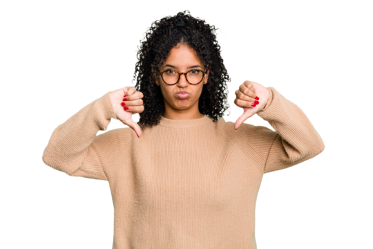Young cute brazilian woman isolated showing a dislike gesture, thumbs down. Disagreement concept.