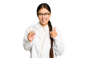 Young asian otorhinolaryngologist woman holding a hearing aid isolated smiling and raising thumb up