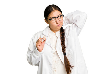 Young asian otorhinolaryngologist woman holding a hearing aid isolated touching back of head,...