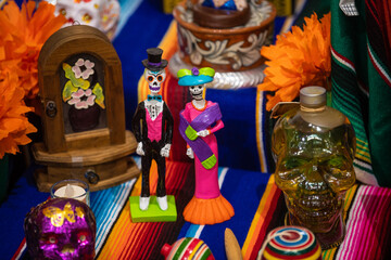 Traditional Dia De Los Muertos Altar. Mexico's Day of the Dead. Painted sugar skulls, candles, skeletons and other decoration. Belgrade, Serbia 01.11.2022