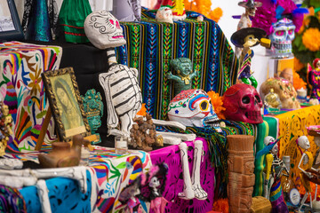 Traditional Dia De Los Muertos Altar. Mexico's Day of the Dead. Painted sugar skulls, candles, skeletons and other decoration. Belgrade, Serbia 01.11.2022