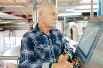 senior man working on a machine