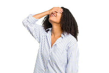 Young african american woman isolated laughs joyfully keeping hands on head. Happiness concept.