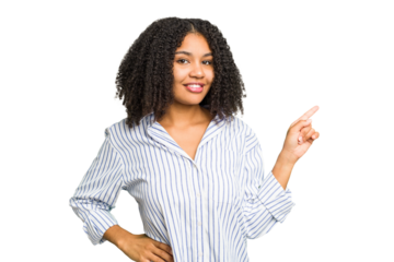 Young african american woman isolated smiling cheerfully pointing with forefinger away.