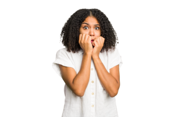 Young african american woman isolated biting fingernails, nervous and very anxious.