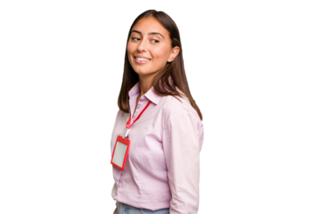 Young caucasian woman with a badge isolated looks aside smiling, cheerful and pleasant.