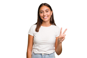 Obraz premium Young cute caucasian woman isolated showing victory sign and smiling broadly.