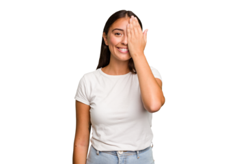 Young cute caucasian woman isolated having fun covering half of face with palm.