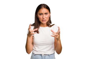 Young cute caucasian woman isolated upset screaming with tense hands.