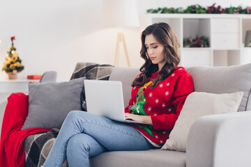 Photo of young concentrated programmer working stay home using her laptop chatting with boss...