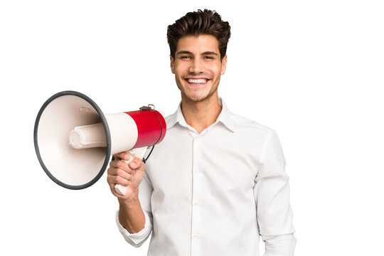 Young caucasian man holding megaphone isolated happy, smiling and cheerful.