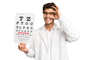 Young caucasian oculist man isolated excited keeping ok gesture on eye.