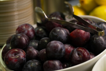 plums. plums for breakfast. detail. interior photo.