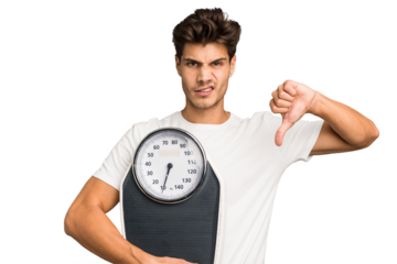 Young caucasian man holding a scale isolated showing a dislike gesture, thumbs down. Disagreement concept.