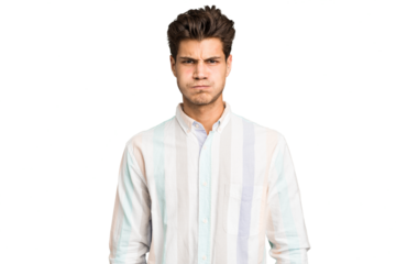 Young caucasian handsome man isolated blows cheeks, has tired expression. Facial expression concept.