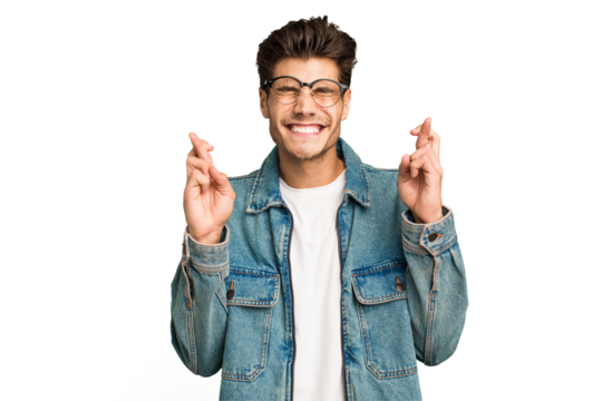 Young caucasian handsome man isolated crossing fingers for having luck