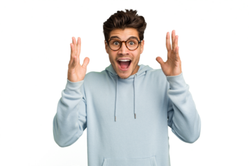 Young caucasian handsome man isolated celebrating a victory or success, he is surprised and shocked.