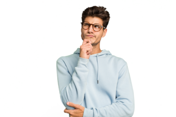 Young caucasian handsome man isolated thinking and looking up, being reflective, contemplating, having a fantasy.