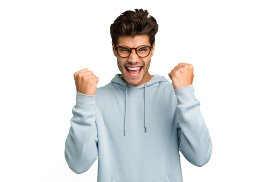 Young caucasian handsome man isolated cheering carefree and excited. Victory concept.