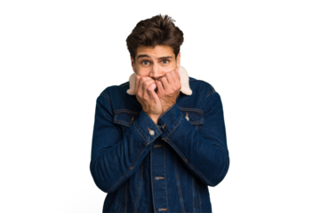 Young caucasian handsome man isolated biting fingernails, nervous and very anxious.